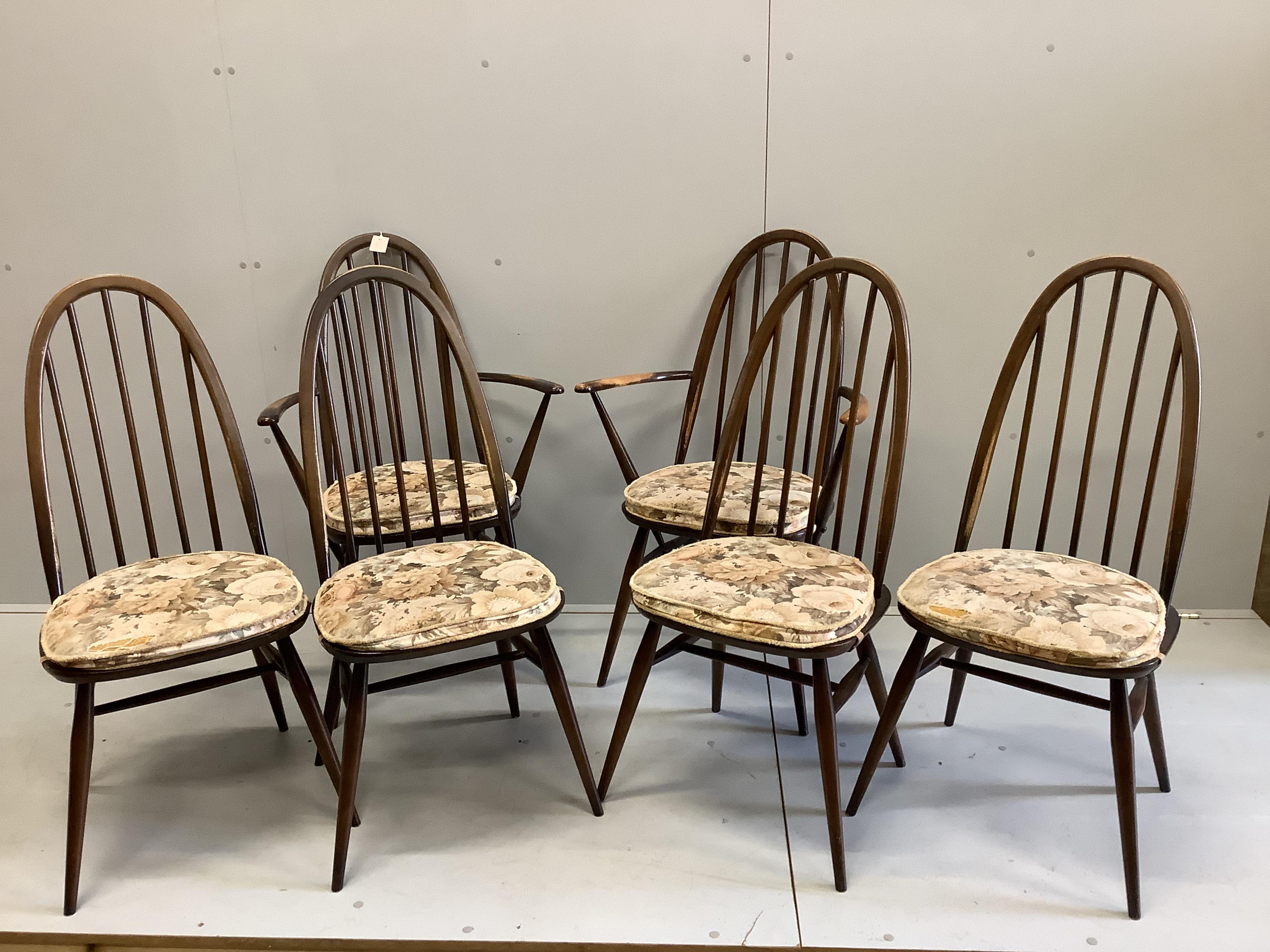 An Ercol elm drop leaf dining table, 124cm extended, width 112cm, height 71cm and six Ercol elm and beech dining chairs (two with arms)